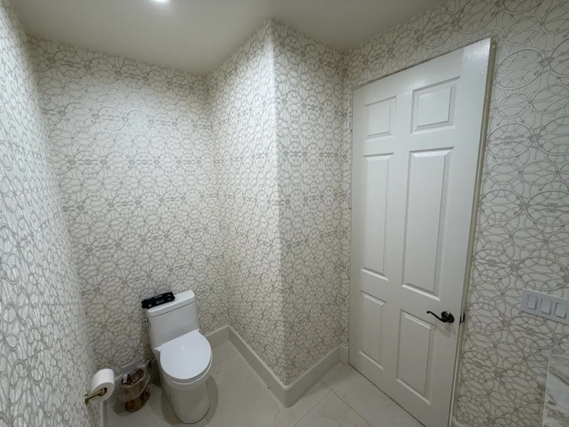 Murphy Wallpaper Installer clean wall surface after professional wallpaper removal in Greenway Parks, Dallas